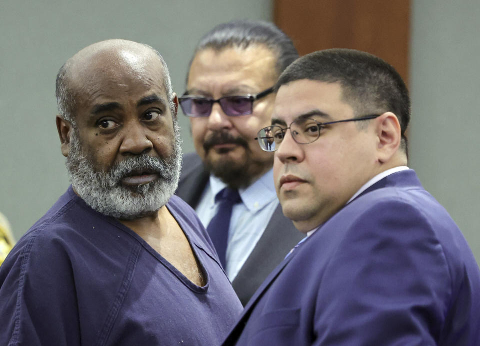 FILE - Duane "Keffe D" Davis, left, with deputy special public defenders Robert Arroyo, right, and Charles Cano, rear, appears for his arraignment at the Regional Justice Center, Nov. 2, 2023, in Las Vegas. The former Los Angeles-area gang leader accused of murder in the killing of hip-hop music icon Tupac Shakur in 1996 in Las Vegas is seeking to be released to house arrest ahead of his murder trial in June 2024. A Nevada judge on Tuesday, Dec. 19, 2023, set a Tuesday, Jan. 2, 2024, hearing on the request by Davis. (Ethan Miller/Pool Photo via AP, File)