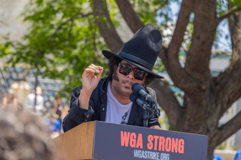 LOS ANGELES, CALIFORNIA - JUNE 21: Boots Riley speaks at the 2023 Writers Guild Of America Strike: Rally And March at Pan Pacific Park on June 21, 2023 in Los Angeles, California. (Photo by Momodu Mansaray/Getty Images)
