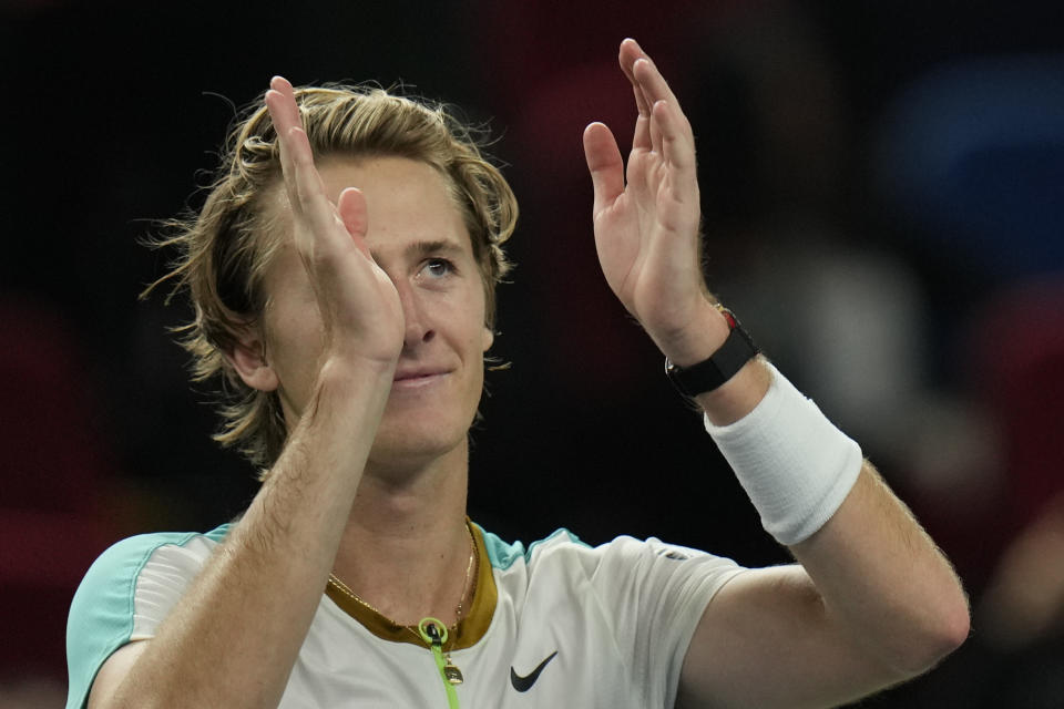 Sebastian Korda of the United States celebrates after defeating his compatriot Ben Shelton during the men's singles quarterfinal match in the Shanghai Masters tennis tournament at Qizhong Forest Sports City Tennis Center in Shanghai, China, Thursday, Oct. 12, 2023. (AP Photo/Andy Wong)