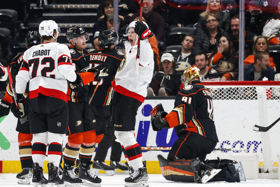 Ottawa Senators forward Brady Tkachuk, second from right, celebrates after scoring on Anaheim Ducks goalie Anthony Stolarz, right, during the first period of an NHL hockey game Friday, Nov. 25, 2022, in Anaheim, Calif. (AP Photo/Ringo H.W. Chiu)