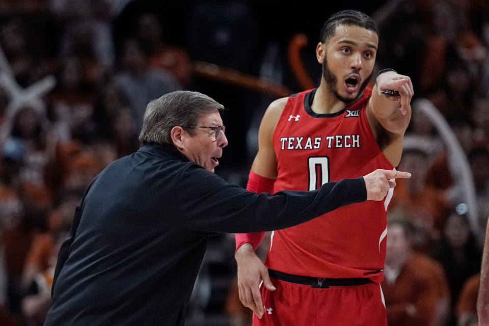 Texas Tech head coach Mark Adams, left, talks with forward Kevin Obanor (0) during the team's game against Texas on Jan. 14, 2023. (AP Photo/Eric Gay)