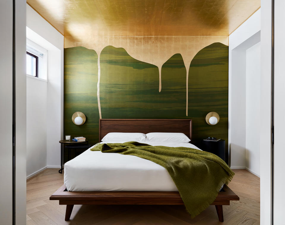 a gold leaf ceiling in a bedroom