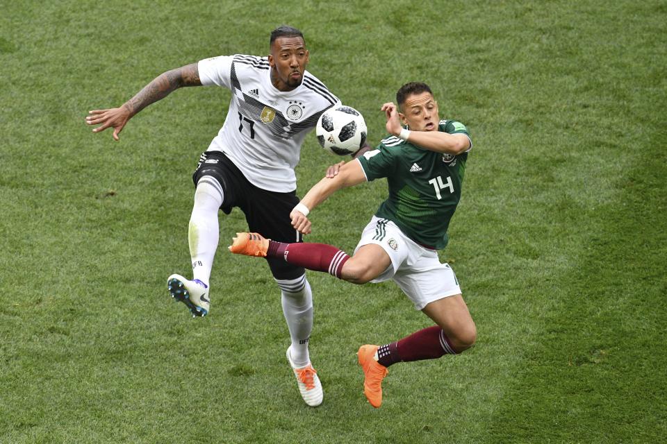 <p>Mexico’s forward Javier Hernandez (R) vies for the ball with Germany’s defender Jerome Boateng during the Russia 2018 World Cup Group F football match between Germany and Mexico at the Luzhniki Stadium in Moscow on June 17, 2018. (Photo by Mladen ANTONOV / AFP) </p>