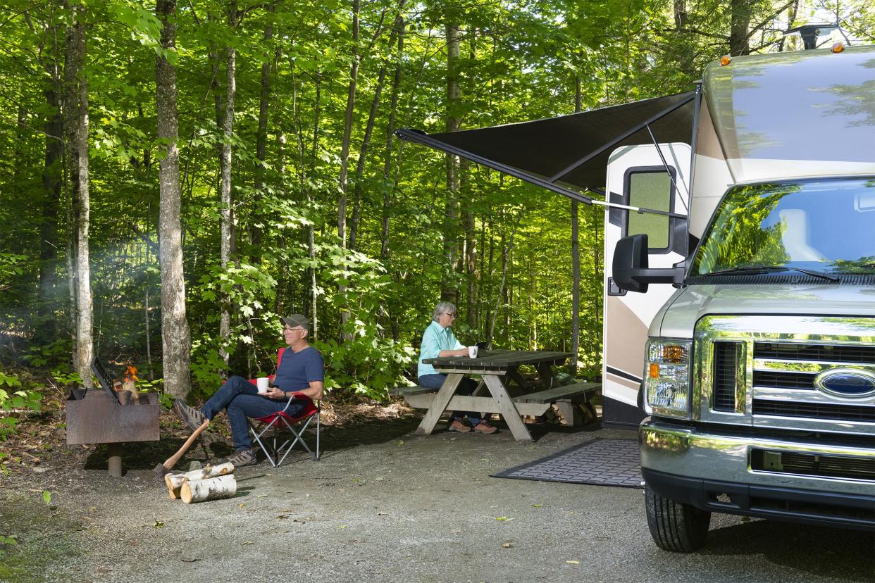 Couple camping with RV