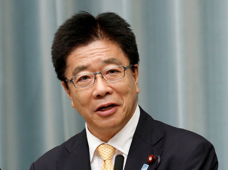 FILE PHOTO: Japan's Health, Labour and Welfare Minister Katsunobu Kato speaks at a news conference in Tokyo