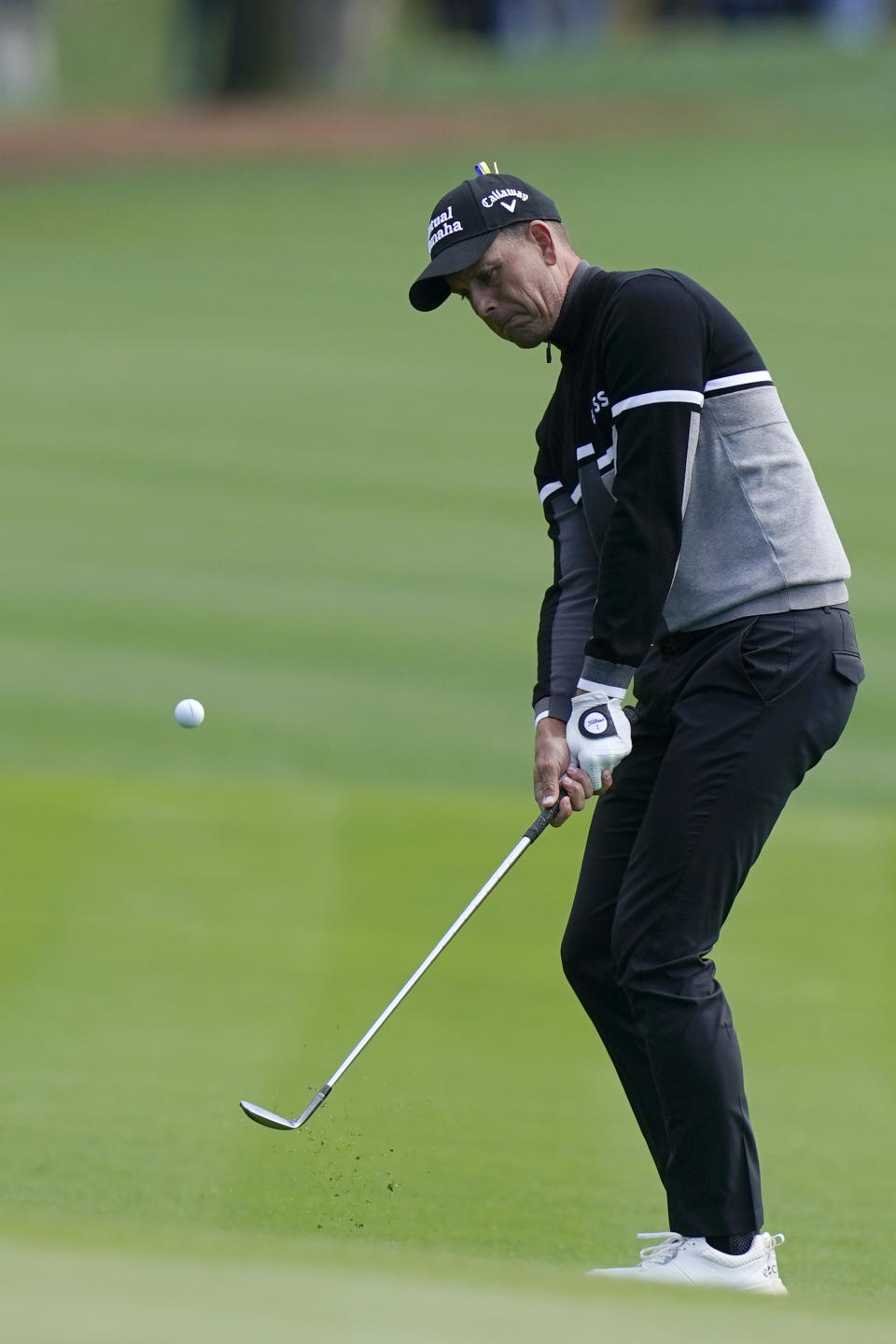 Henrik Stenson, of Sweden, hits to the 18th green during the first round of play in The Players Championship golf tournament Saturday, March 12, 2022, in Ponte Vedra Beach, Fla. (AP Photo/Lynne Sladky)