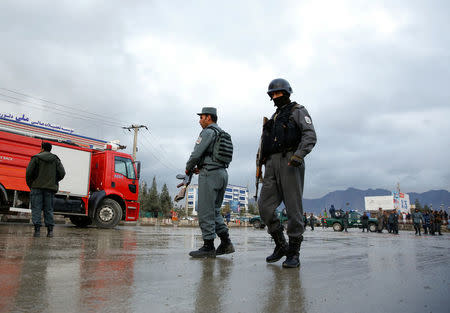 Afghan policemen stand guard at the site of a suicide bomb attack in Kabul, Afghanistan November 16, 2017. REUTERS/Mohammad Ismail