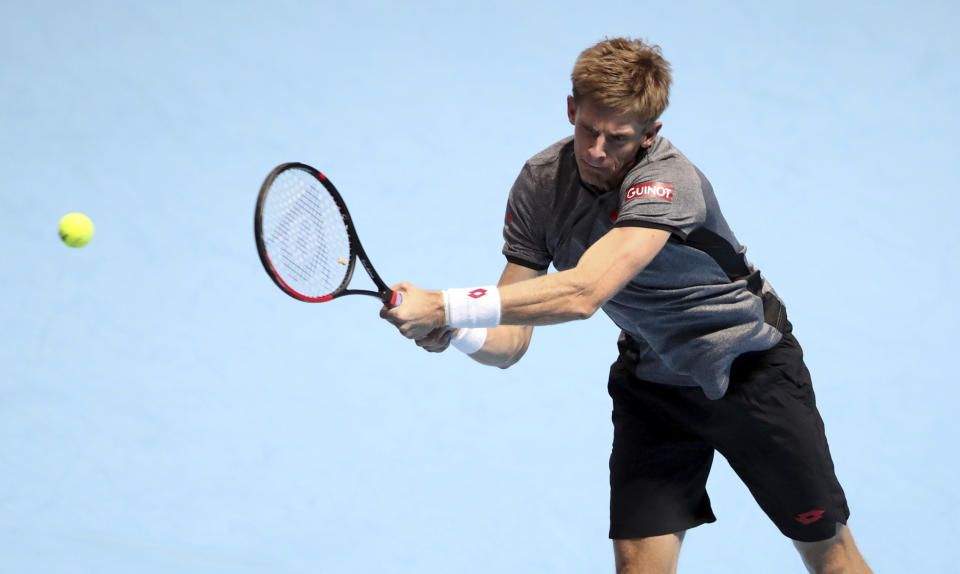 South Africa's Kevin Anderson plays a return to Switzerland's Roger Federer during their ATP World Tour Finals men's singles tennis match at the O2 arena in London, Thursday, Nov. 15, 2018. (John Walton/PA via AP)