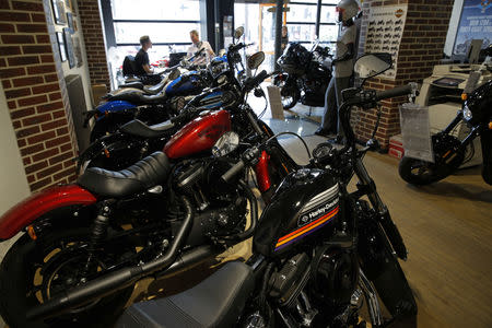 FILE PHOTO: The logo of U.S. motorcycle company Harley-Davidson is seen on one of their models at a shop in Paris, France, August 16, 2018. REUTERS/Philippe Wojazer