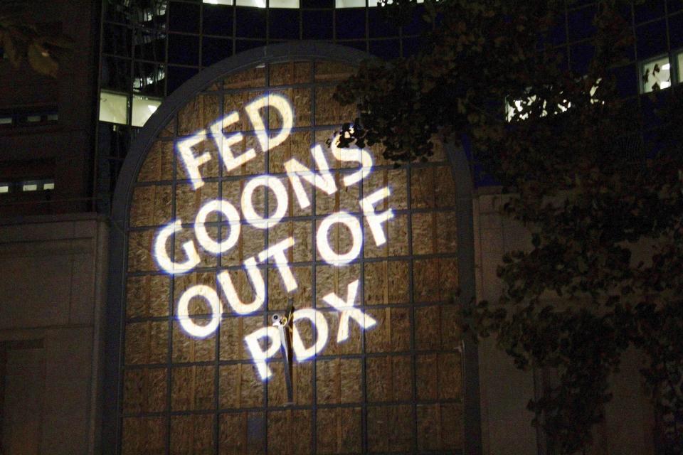 Protesters projected these words on the front of the Multnomah County Justice Center, Monday, July 20, 2020 in Portland, Ore (AP Photo/Gillian Flaccus)