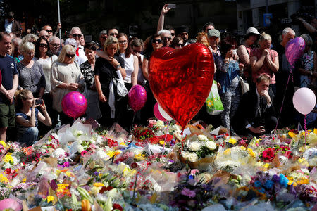 People observe a minute of silence for the victims of the Manchester Arena attack, in St Ann's Square, in central Manchester, Britain May 25, 2017. REUTERS/Stefan Wermuth