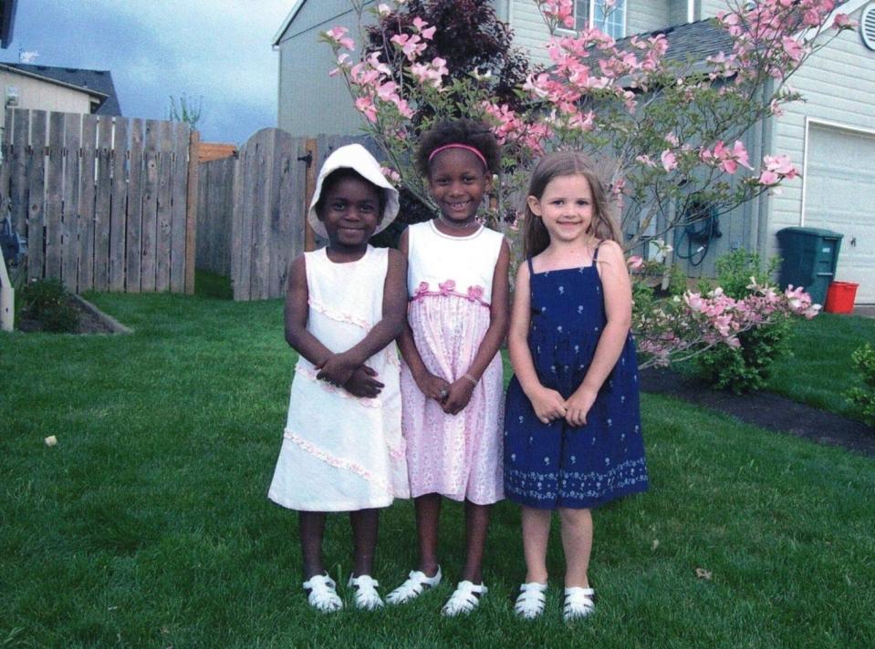 Jazmin and Widnie Williamson, who are biological sisters from Haiti, pose with their adoptive sister, Allie. The Williamsons already had three biological children when they first felt called to adopt. The idea was to find a little girl, who would be a sister for Allie. Their mother, Jana Williamson, said God's plan for the family ended up being bigger than that. The orphanage asked if they would consider adopting Jazmin and Widnie together.