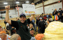 Organizers at the Topsfield Fair in Rhode Island said Ron Wallace of Greene, R.I., had taken the top honors at the fair and broken the world record with a pumpkin weighing in at 2,009 pounds, Sept. 28, 2012. (AP Photo/The Eagle-Tribune, Paul Bilodeau)