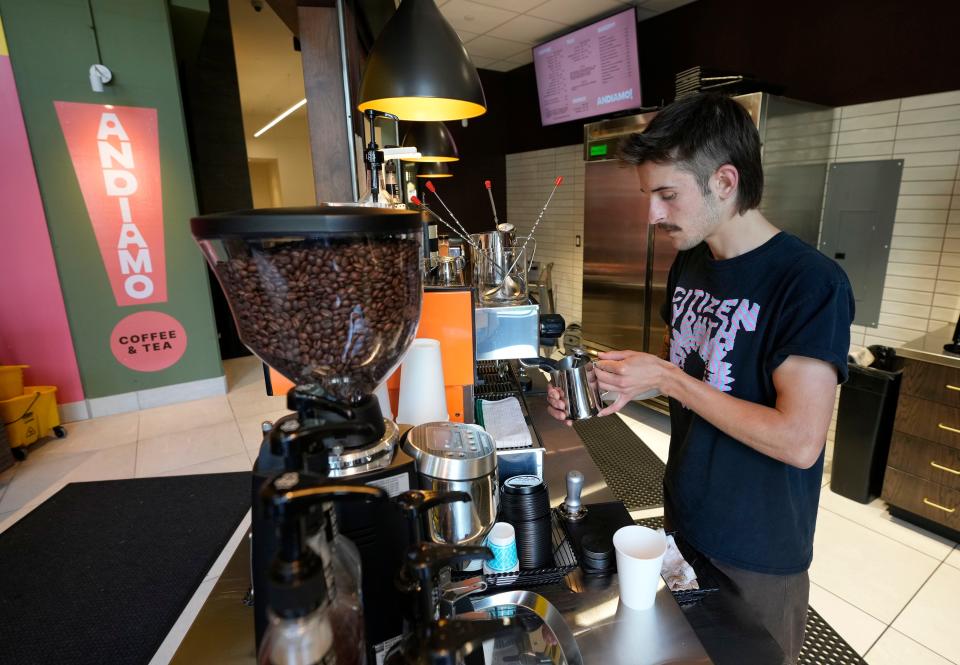 Barista Sam Janisch makes a latte  at Andiamo Coffee and Tea, 777 N. Van Buren St.