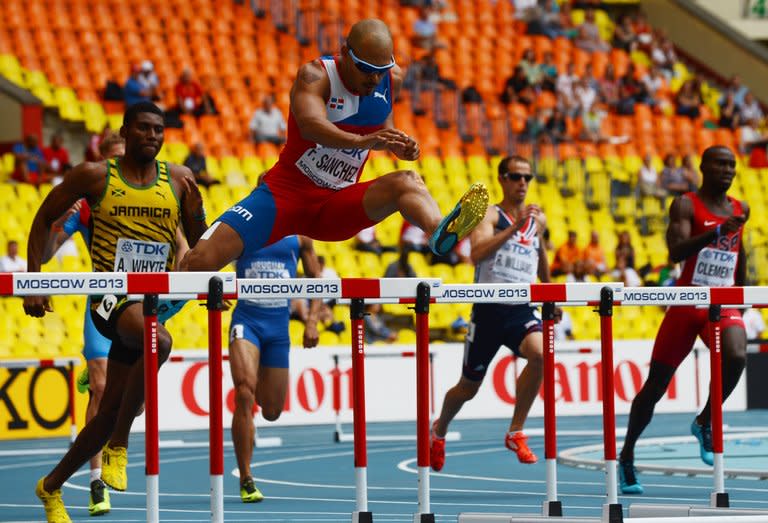 Dominican Republic's Felix Sanchez (centre) competes in the men's 400 metres hurdles at the World Athletics Championships in Moscow, on August 12, 2013
