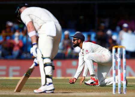 Cricket - India v New Zealand - Third Test cricket match - Holkar Cricket Stadium, Indore, India - 11/10/2016. India's Virat Kohli takes the catch of New Zealand's James Neesham. REUTERS/Danish Siddiqui