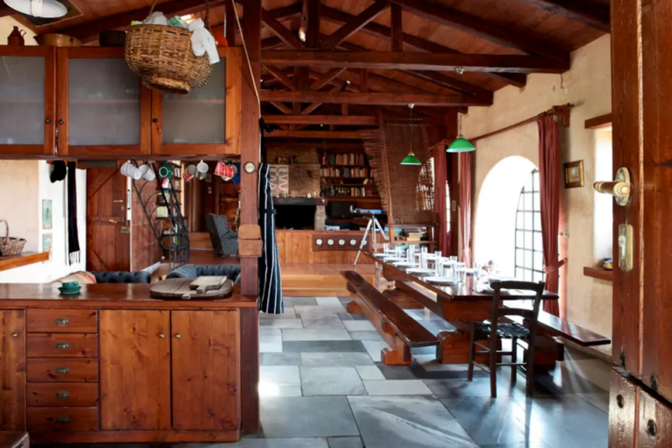 <p>The villa’s rustic kitchen, with wood interior and beamed ceiling is seen here. (Airbnb) </p>