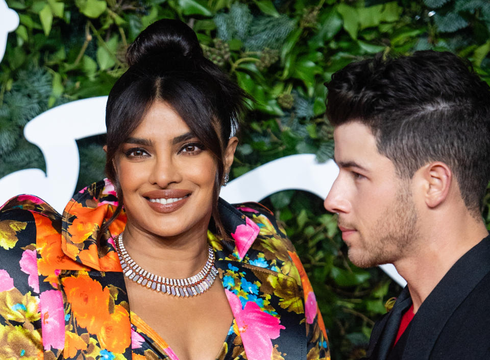 Priyanka looking the camera and Nick looking at her