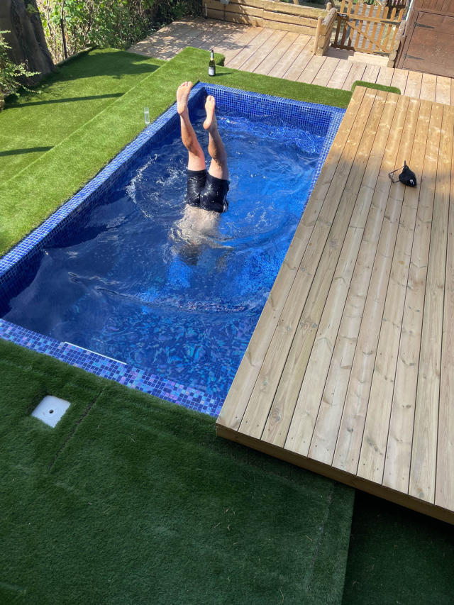 A dad has found a unique way to beat the heatThe swimming pool in Alex's gardenwave - after building a SWIMMING POOL in his back garden - entirely using YouTube tutorials.Alex Dodman, 36, from Saffron Walden, Essex, dreamt of building a swimming pool in his back garden, and thanks to some handy YouTube videos, he did just that.The ambulance worker has a hand at impressive home DIY projects, but not just your average putting up shelves or hanging a mirror, Alex previously built a home cinema and gym saving Â£75K, with this latest project being his most impressive yet. Moving into his home in 2017 with partner Sarah, 36, a HR manager and their two young children Allie, five, and Eddie, two, Alex has been getting busy renovating the family home, ripping it out and starting over, but saved his biggest project until last - the pool.Claiming that his friends and family are used to his wild ideas, Alex underestimated how tough this one would really be, building the pool entirely by himself. (Caters)