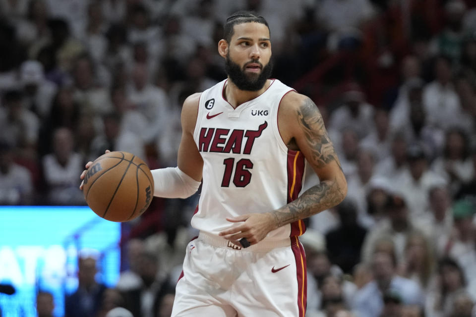 Miami Heat forward Caleb Martin dribbles the ball during the Eastern Conference finals on May 23, 2023, in Miami.  (AP Photo/Wilfredo Lee)
