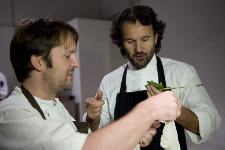 Italian chef Carlo Cracco (R) and Danish chef Rene Redzepi taste ingredients during the "Fooding" event in Milan on October 15, 2010. AFP PHOTO / GIUSEPPE CACACE (Photo credit should read GIUSEPPE CACACE/AFP/Getty Images)