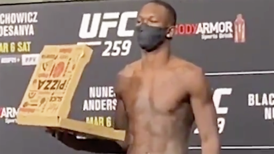 Israel Adesanya is feeling so confident ahead of UFC 259 that he brought a pizza to his weigh-in. Picture: ESPN MMA/Twitter