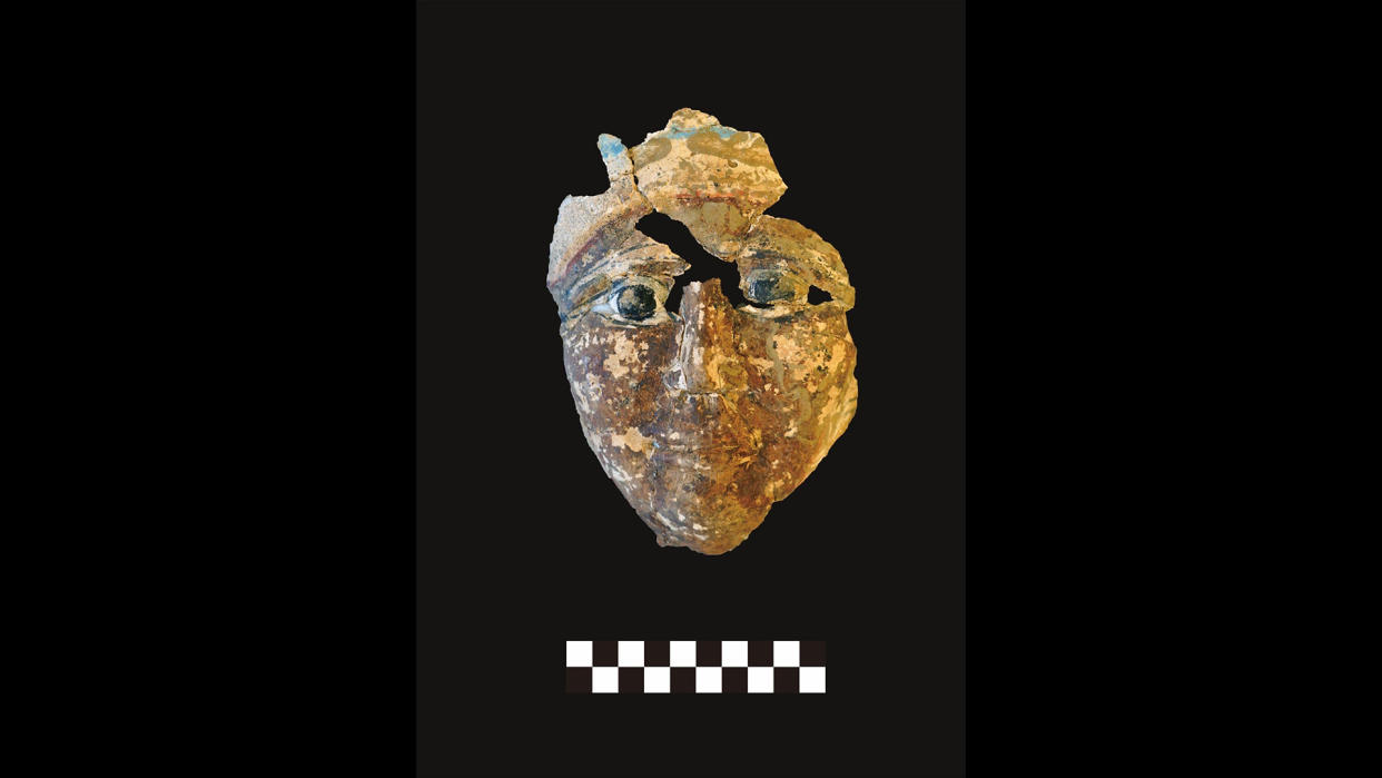  A mummy mask that was discovered by the excavation team. 