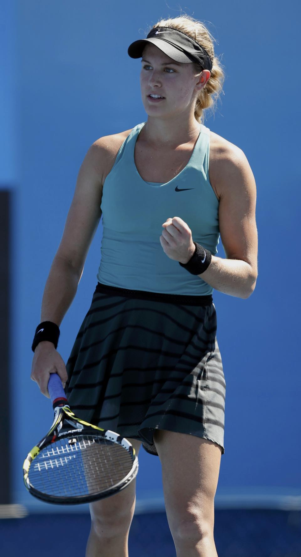 Eugenie Bouchard of Canada celebrates defeating Tang Haochen of China in their women's singles match at the Australian Open 2014 tennis tournament in Melbourne January 13, 2014. REUTERS/Brandon Malone (AUSTRALIA - Tags: SPORT TENNIS)