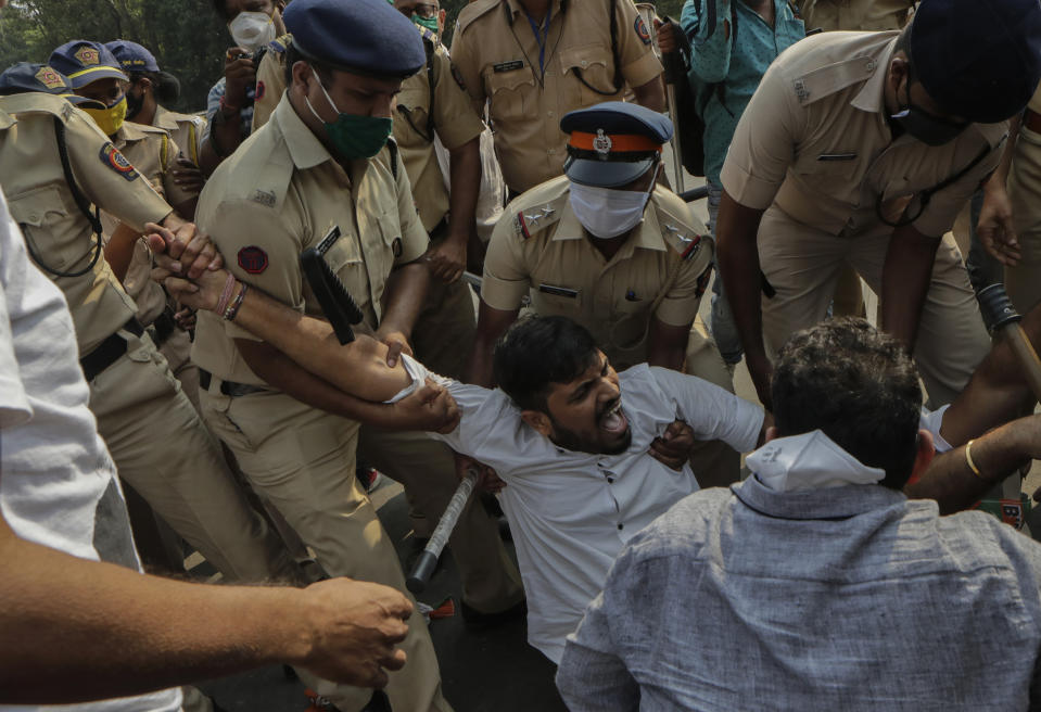 Police detain Bharatiya Janata party workers protesting against Maharashtra state government for the arrest of television news anchor Arnab Goswami in Mumbai, India, Wednesday, Nov. 4, 2020. Indian police on Wednesday said they arrested the Republic TV founder and charged him with abetment to suicide in connection with the 2018 deaths of an interior designer and the designer's mother. (AP Photo/Rajanish Kakade)