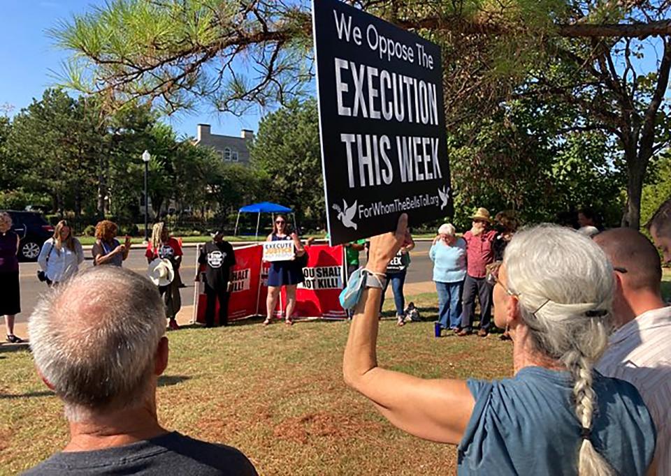 Protesters gather Thursday outside the Governor's Mansion to protest the execution of James Coddington.