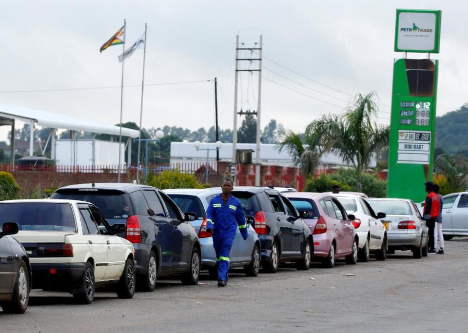 Motorists queue for fuel in Harare.