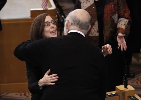 Oregon Governor Kate Brown greets legislators after swearing in ceremony at the state capital building in Salem, Oregon February 18, 2015. REUTERS/Steve Dipaola