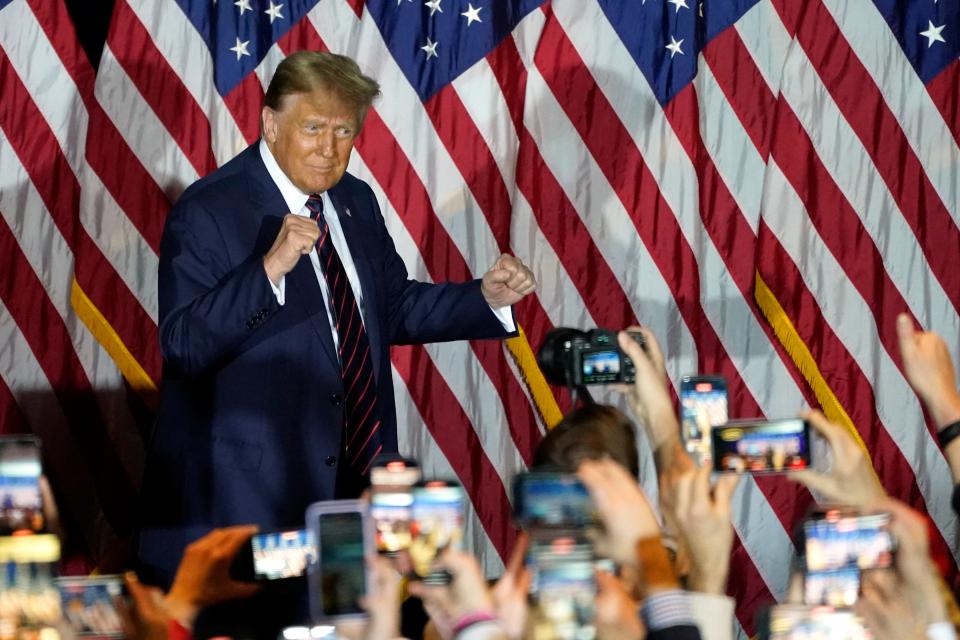 Republican presidential hopeful and former US President Donald Trump gestures during an Election Night Party in Nashua, New Hampshire, on January 23, 2024.