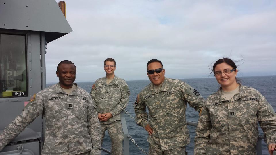 Spc. Jay Tenison poses with three officers from his Army Reserve unit in the spring of 2012. (Courtesy of Jay Tenison)