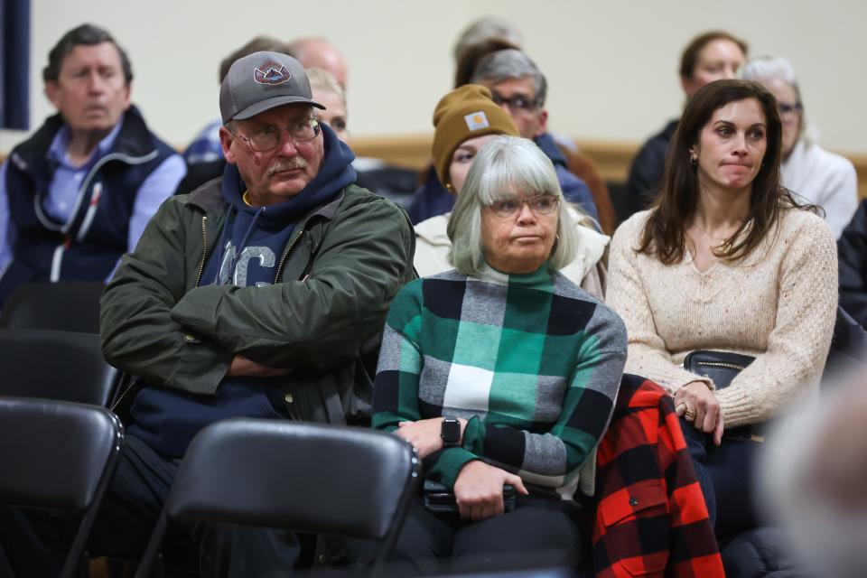 North Hampton resident Lori Cotter listens during a public hearing regarding the proposal to take her property by eminent domain for a cell tower Thursday, Feb. 2, 2023.