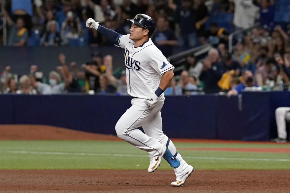 Tampa Bay Rays' Ji-Man Choi celebrates his solo home run against the Boston Red Sox during the sixth inning of Game 2 of a baseball American League Division Series, Friday, Oct. 8, 2021, in St. Petersburg, Fla. (AP Photo/Steve Helber)