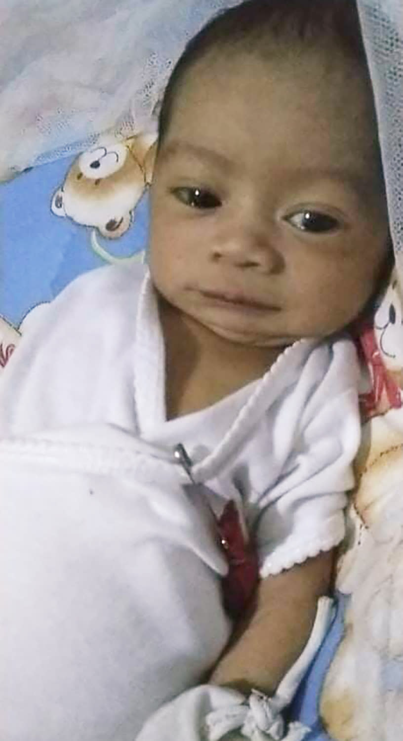 This undated photo provided by Ronnel Manjares shows his son Kobe Christ Manjares in metropolitan Manila, Philippines. Philippines, Wednesday, July 15, 2020. Manjares' 16-day-old son Kobe was heralded as the country's youngest COVID-19 survivor. But the relief and joy proved didn't last. Three days later, Kobe died on June 4 from complications of Hirschsprung disease, a rare birth defect. (Ronnel Manjares via AP)