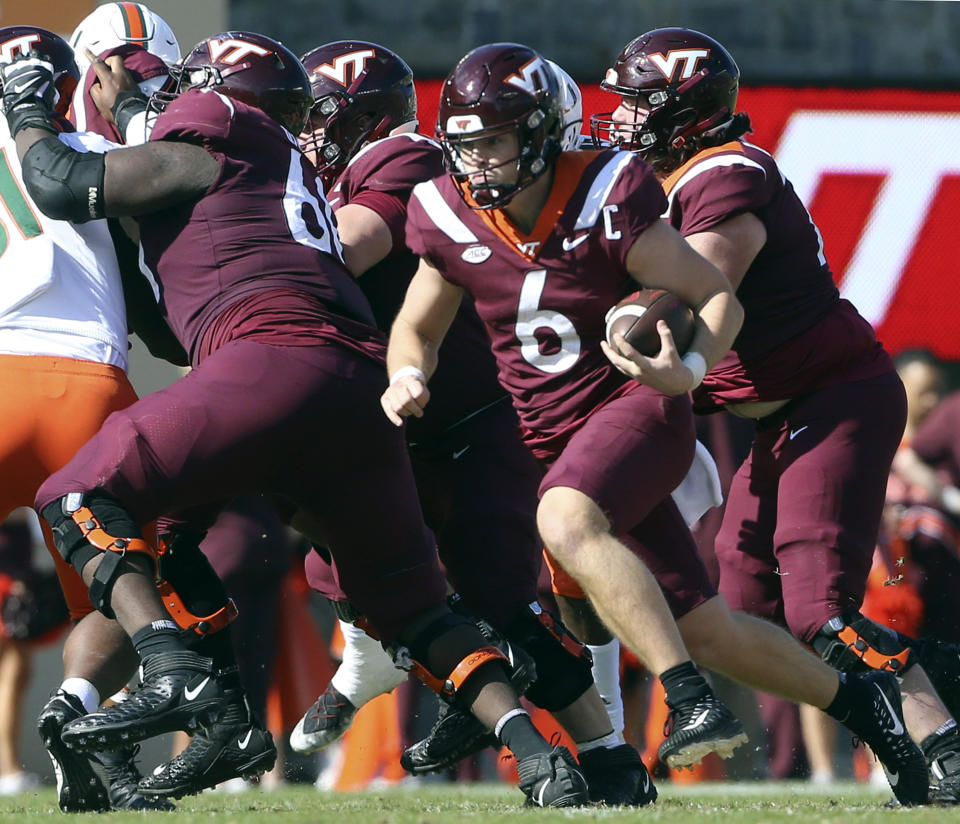 Virginia Tech quarterback Grant Wells (6) runs for a first down in the second half of an NCAA football game against Miami, Saturday Oct. 15 2022, in Blacksburg Va. (Matt Gentry/The Roanoke Times via AP)