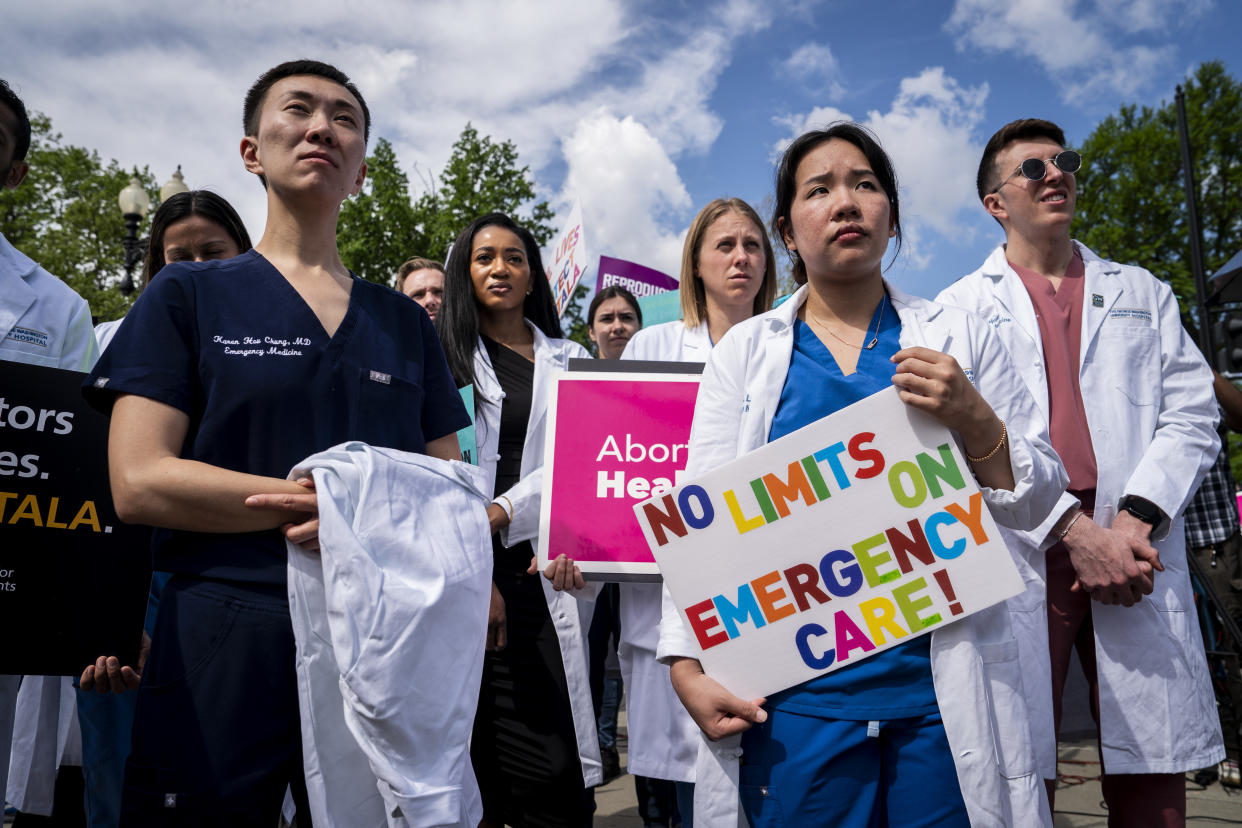 Health care workers from George Washington University Hospital gather with abortion rights protesters outside the Supreme Court in Washington, on Wednesday morning, April 24, 2024. (Haiyun Jiang/The New York Times)