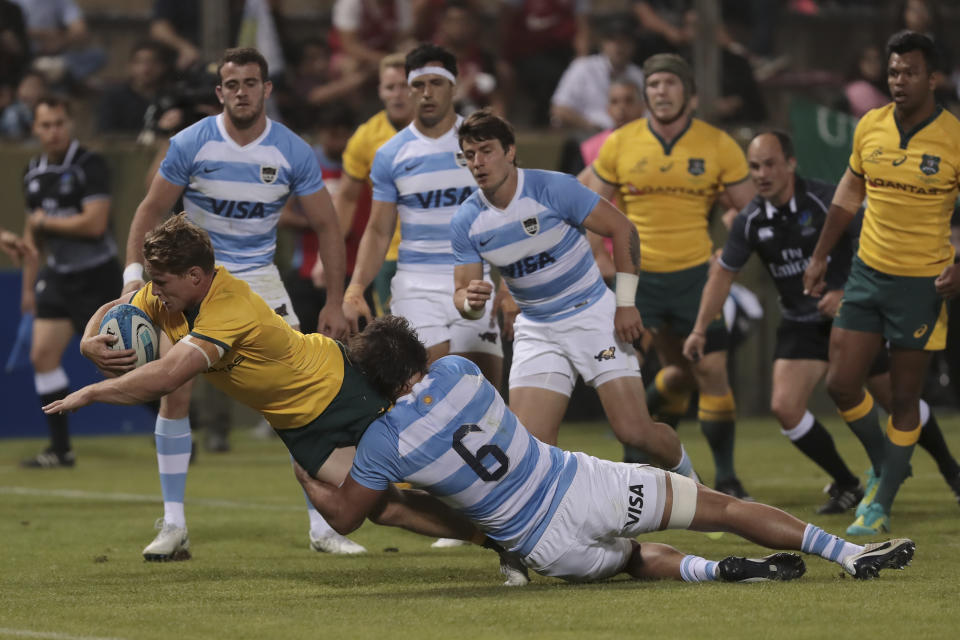 Argentina's Pablo Matera (6) can't stop Australia's Michael Hooper from scoring a try during their Rugby Championship match in Salta, Argentina, Saturday, Oct. 6, 2018. (AP Photo/Gonzalo Prados)