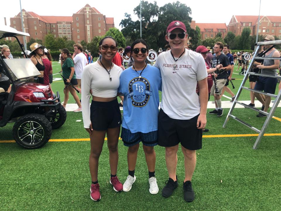 Florida State University senior Kanoka Palmer from Navar, Florida, graduate student Samantha Maltagliati from Fernandina Beach, Florida and senior John Justice from Longwood, Florida are the Marching Chiefs' three new drum majors. They pose for a photo during the band's rehearsal on Monday, August 24, 2022.