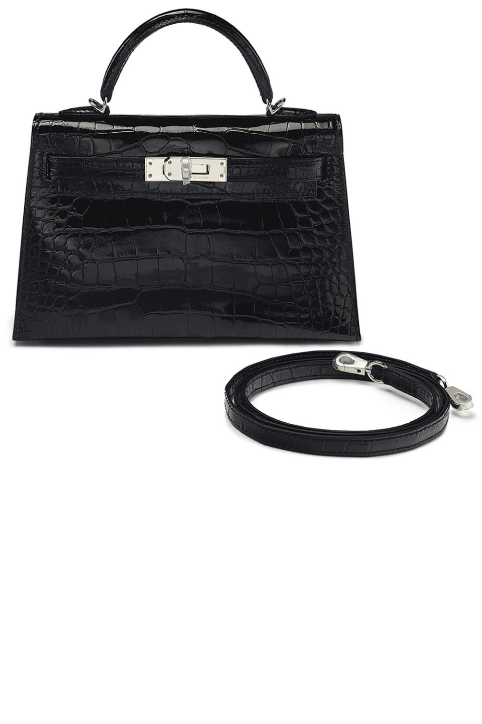 <p><strong>Hermès</strong> shiny black alligator mini Kelly 20 II with Palladium hardware</p><p><strong>Year:</strong> 2017</p><p><strong>Estimate:</strong> $25,000 - $35,000</p><p><strong>Grade:</strong> 1 (as new)</p><p><a rel="nofollow noopener" href="https://onlineonly.christies.com/s/handbags-accessories/shiny-black-alligator-sellier-mini-kelly-20-ii-palladium-hardware-90/50669" target="_blank" data-ylk="slk:More Info;elm:context_link;itc:0;sec:content-canvas" class="link ">More Info</a><br></p>