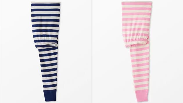 Two pairs of the iconic Hanna Andersson striped pajamas.