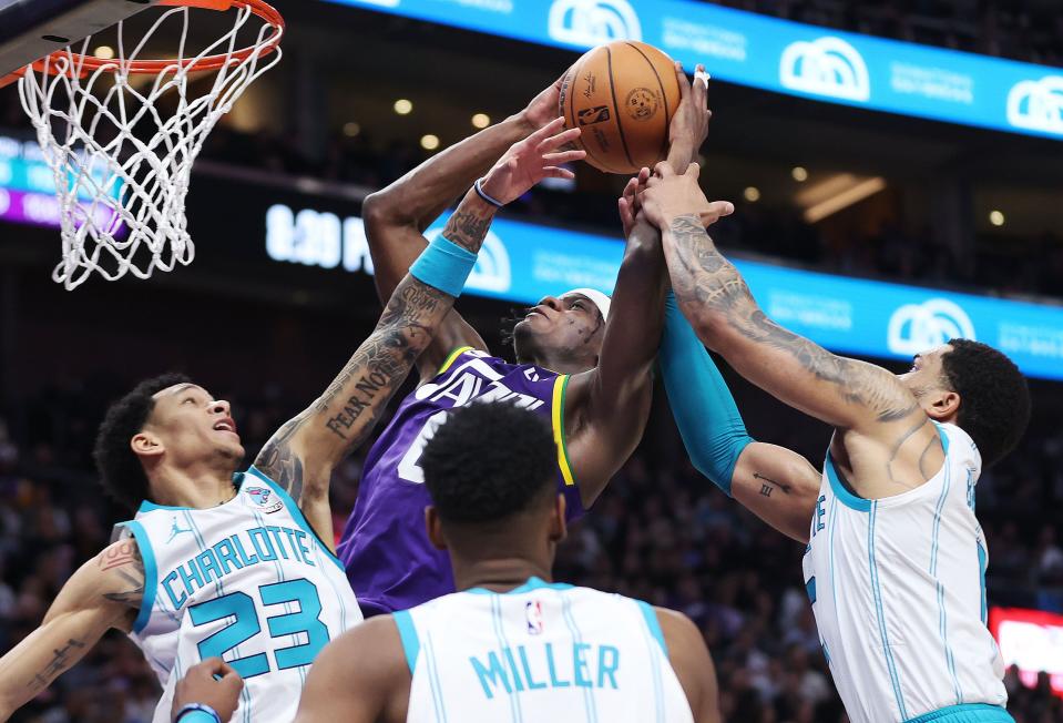 Utah Jazz forward Taylor Hendricks (0) shoots over Charlotte Hornets guard Tre Mann (23) in Salt Lake City on Thursday, Feb. 22, 2024. The Hornets won 115-107. | Jeffrey D. Allred, Deseret News