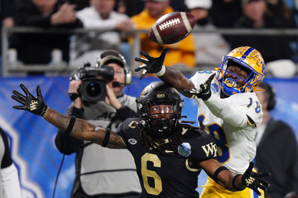 Wake Forest defensive back Ja'Sir Taylor breaks up a pass intended for Pittsburgh wide receiver Shocky Jacques-Louis during the first half of the Atlantic Coast Conference championship NCAA college football game Saturday, Dec. 4, 2021, in Charlotte, N.C. (AP Photo/Jacob Kupferman)