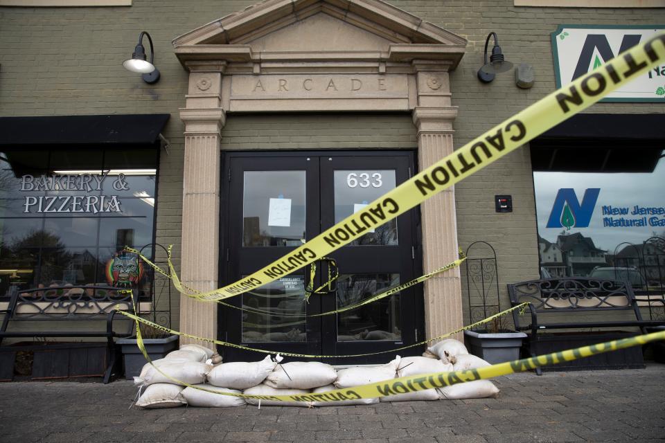 Sand bags are stacked up at business entrances along Lake Ave due to the threat of flood. Rain begins to fall as a strong storm moves into the Jersey Shore area.  
Asbury Park, NJ
Tuesday, January 9, 2024