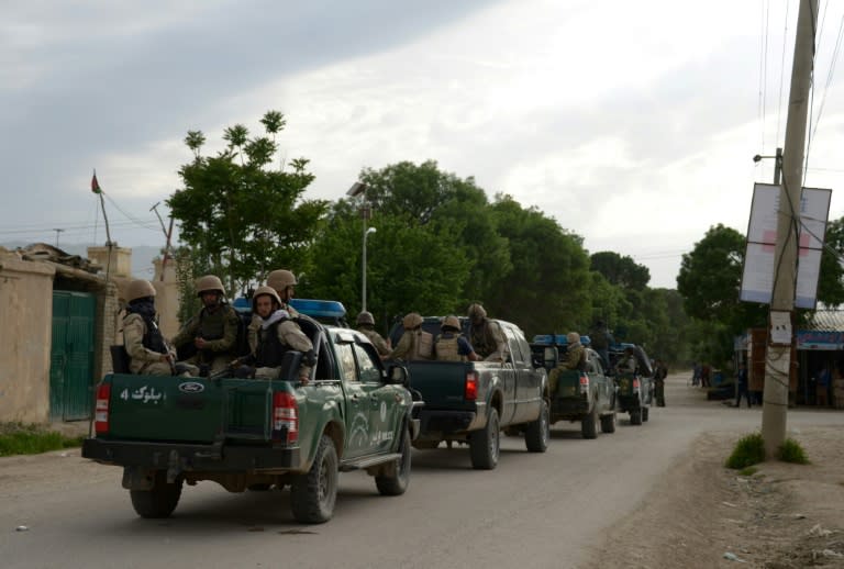 A US military spokesman said "more than 50" Afghan soldiers were killed in a gun and suicide attack, while Afghan officials said eight were killed and 11 wounded