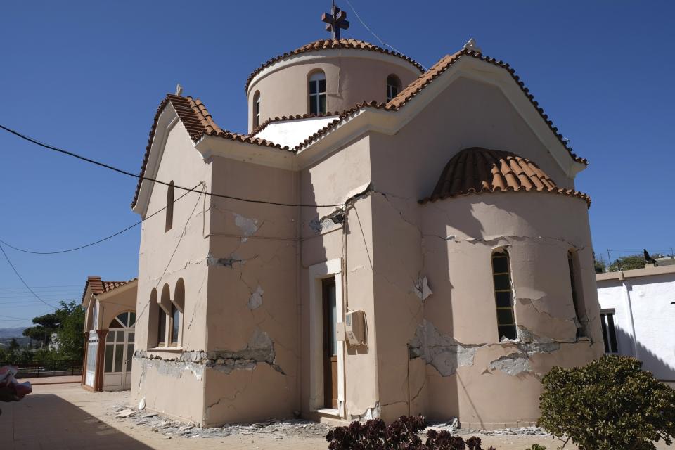A damaged Greek Orthodox church is seen after a strong earthquake in Roussochoria village on the southern island of Crete, Greece, Monday, Sept. 27, 2021. A strong earthquake has struck the Greek island of Crete. One person has been killed and at least nine others have been injured. Homes and churches were damaged and rock slides occurred near the country's fourth-largest city.(AP Photo/Harry Nakos)