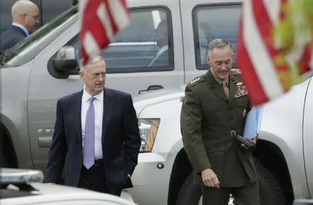 U.S. Defense Secretary James Mattis and Joint Chiefs Chairman General Joseph Dunford depart after briefing members of the U.S. Senate on North Korea at the White House in Washington, U.S, April 26, 2017. REUTERS/Kevin Lamarque