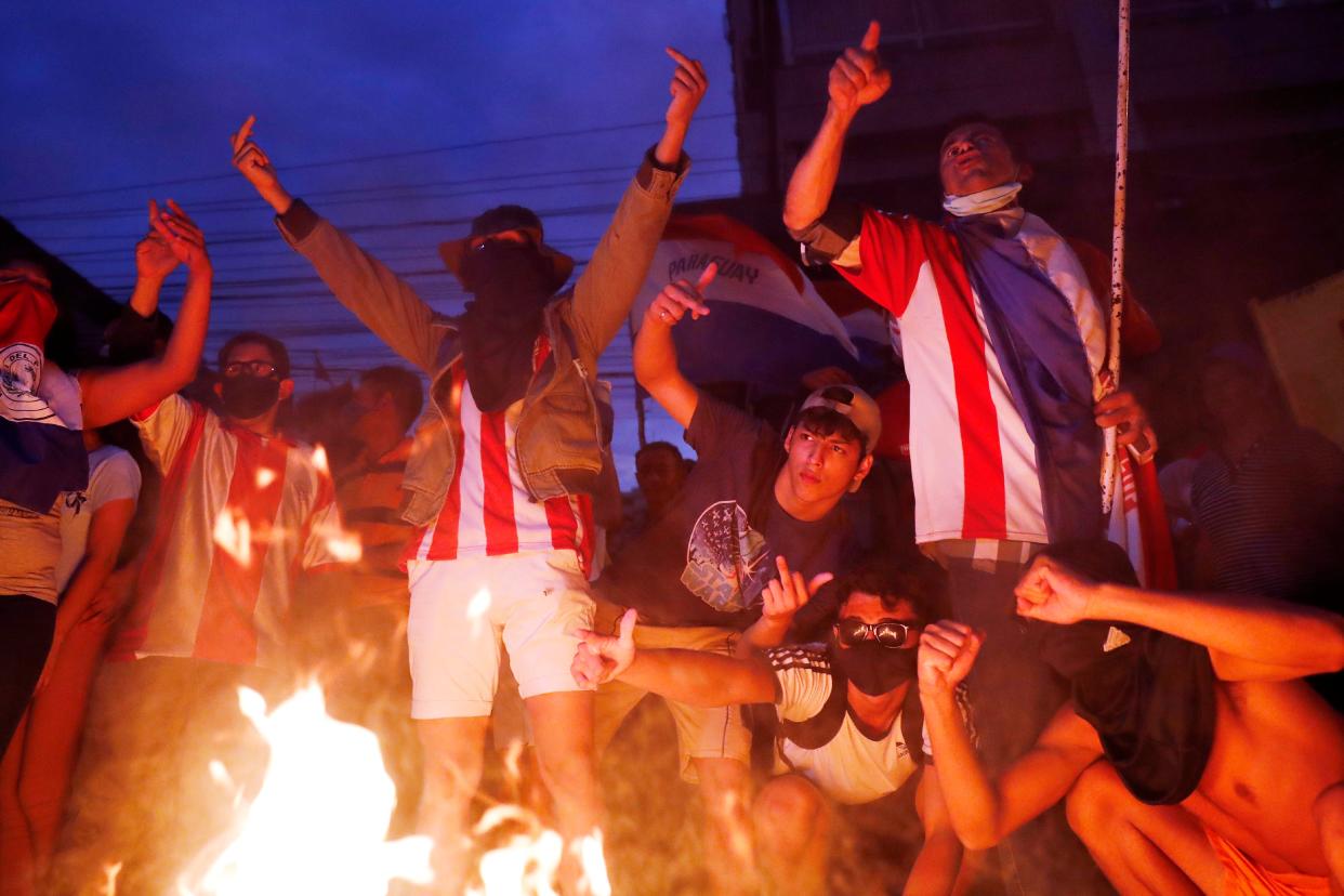 Youth protest against the government of President Mario Abdo Benitez in response to the shortage of medications for COVID-19 patients (AP)